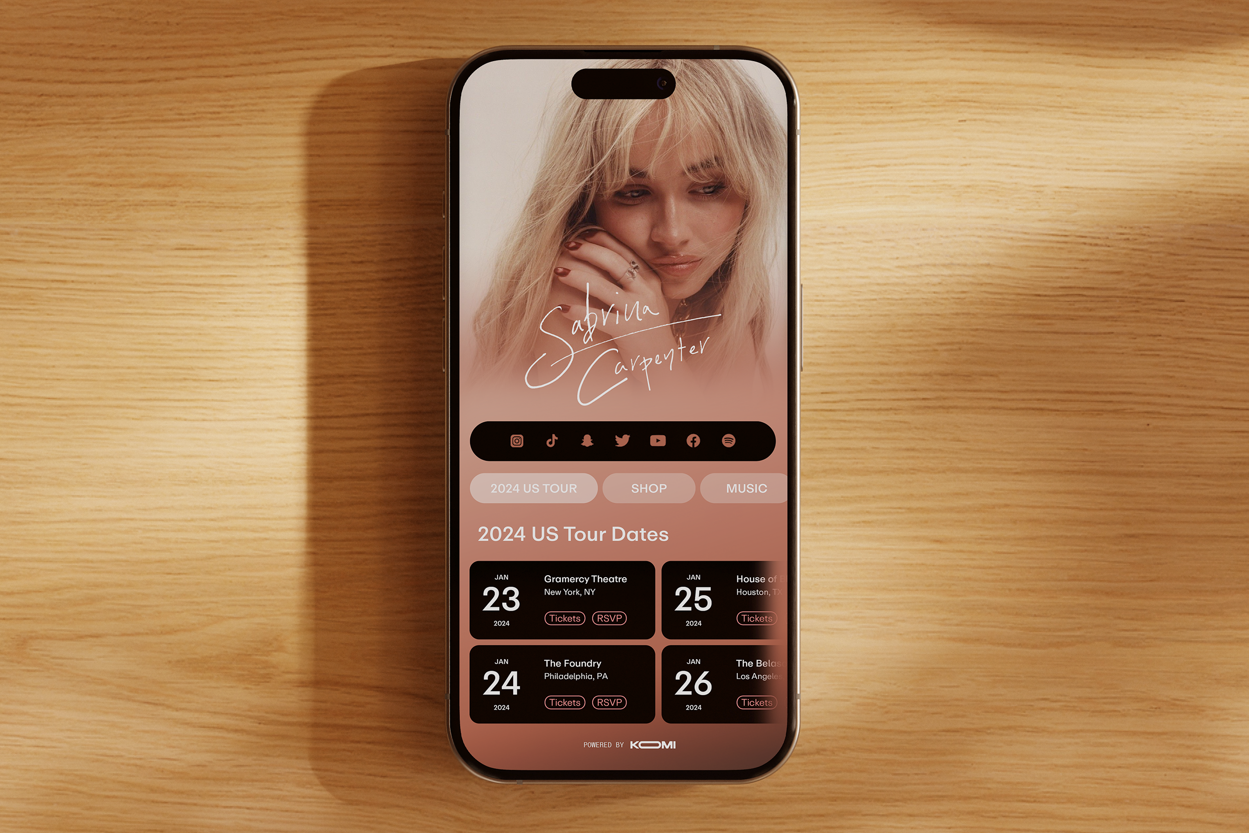 KOMI mobile platform shown on an iPhone